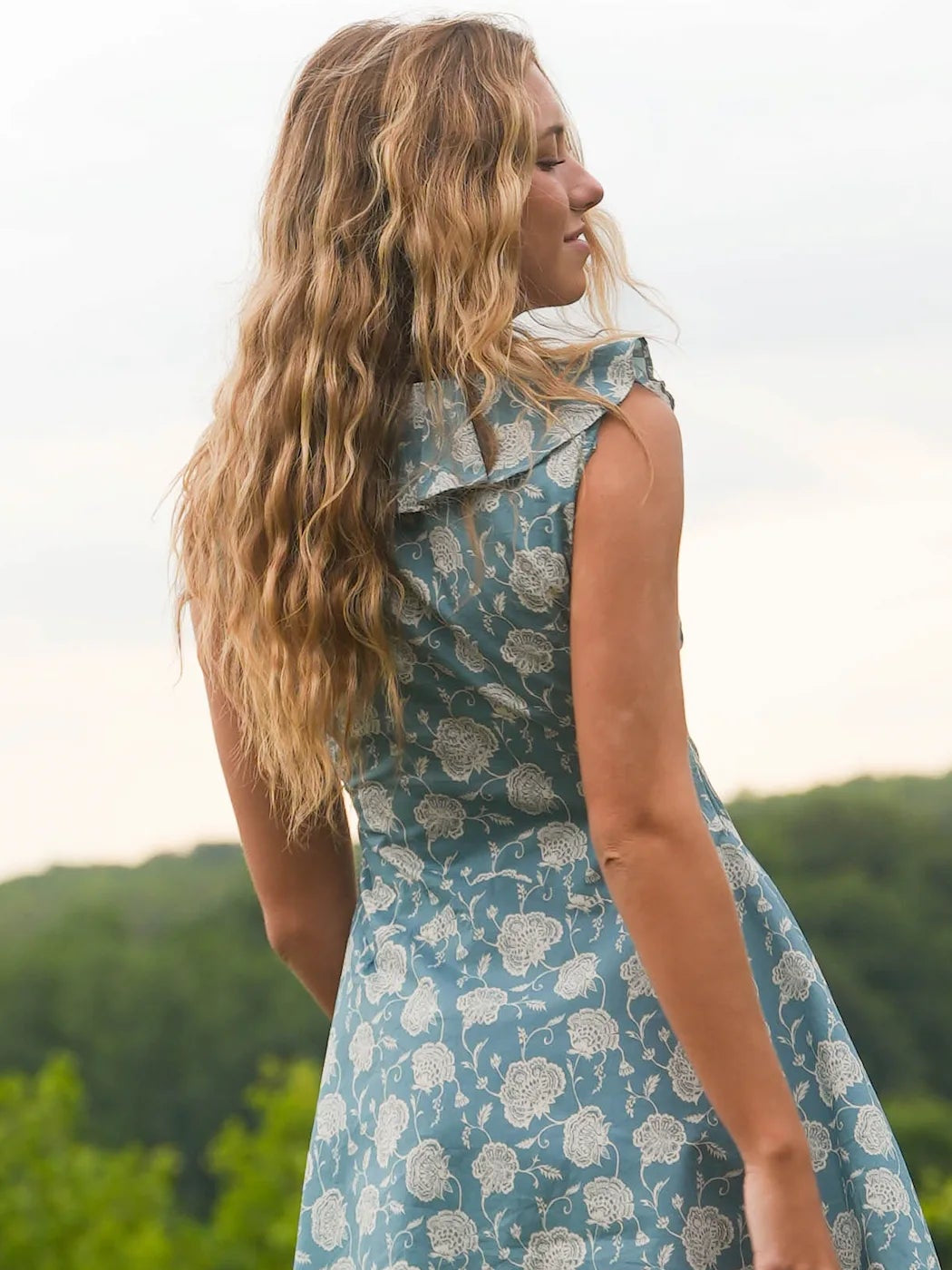 Woman wearing blue floral dress