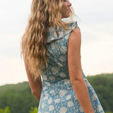 Woman wearing blue floral dress
