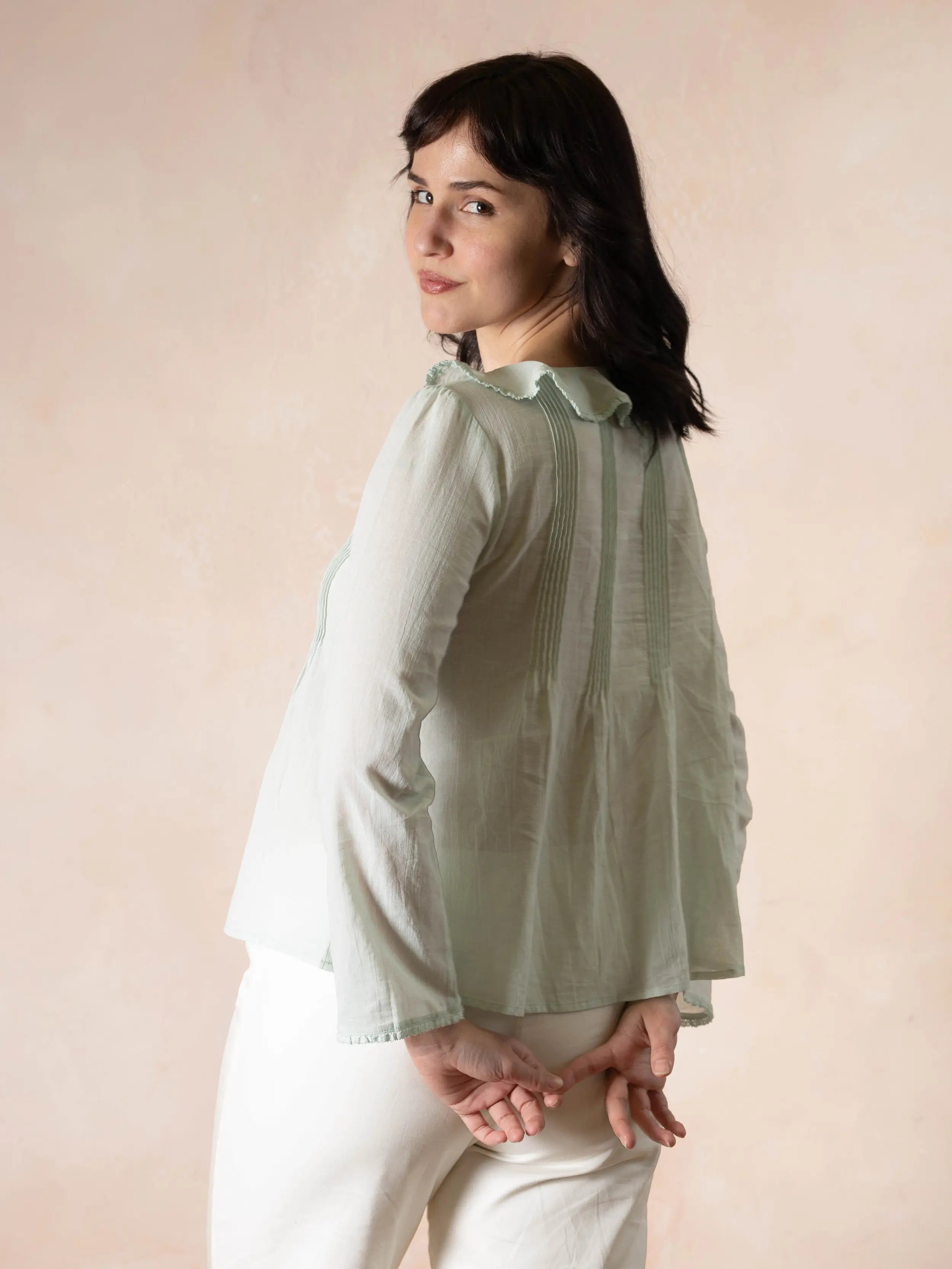 Woman wearing a green blouse