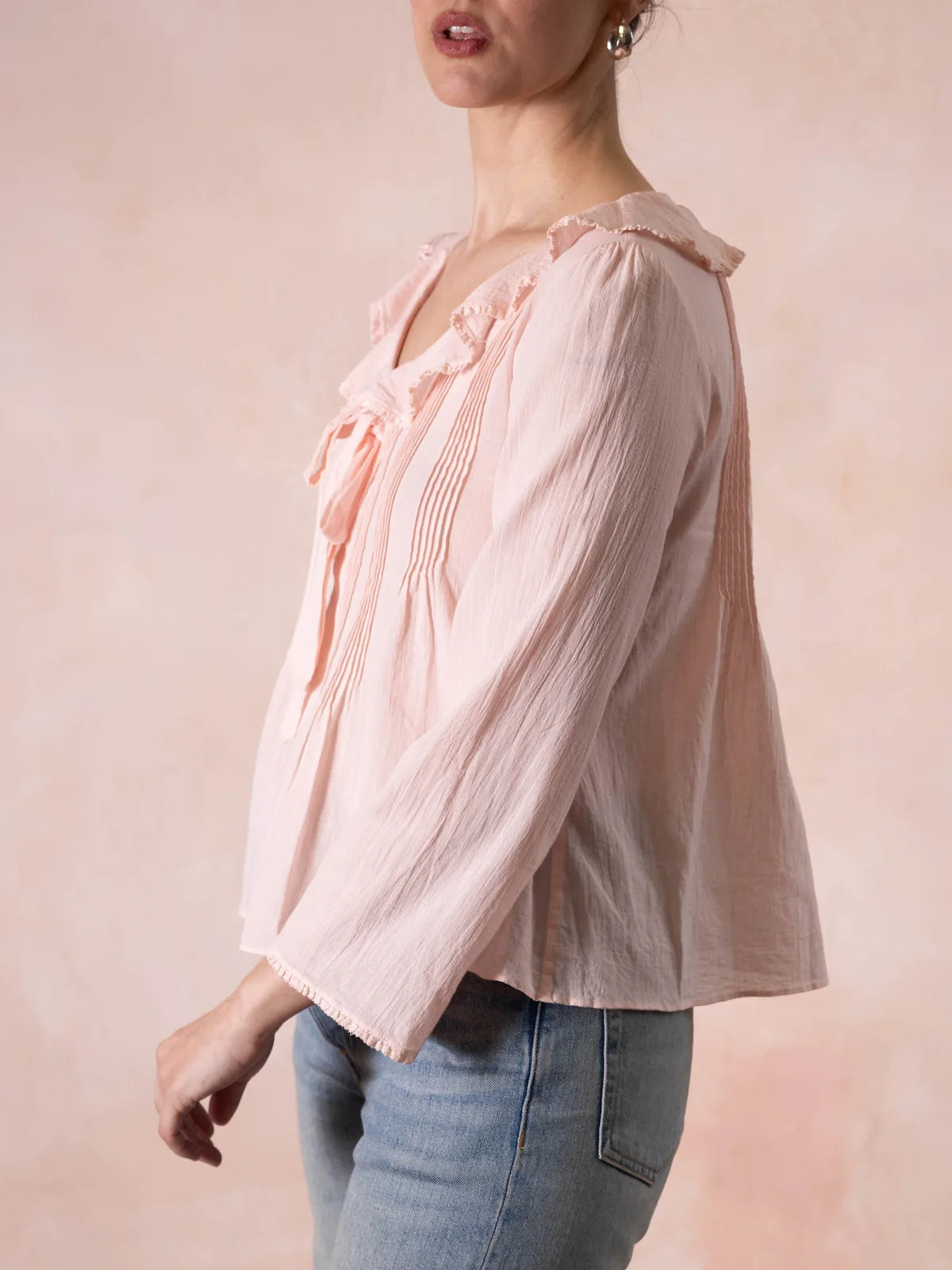 Woman wearing a pink blouse