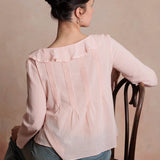 Woman wearing a pink blouse